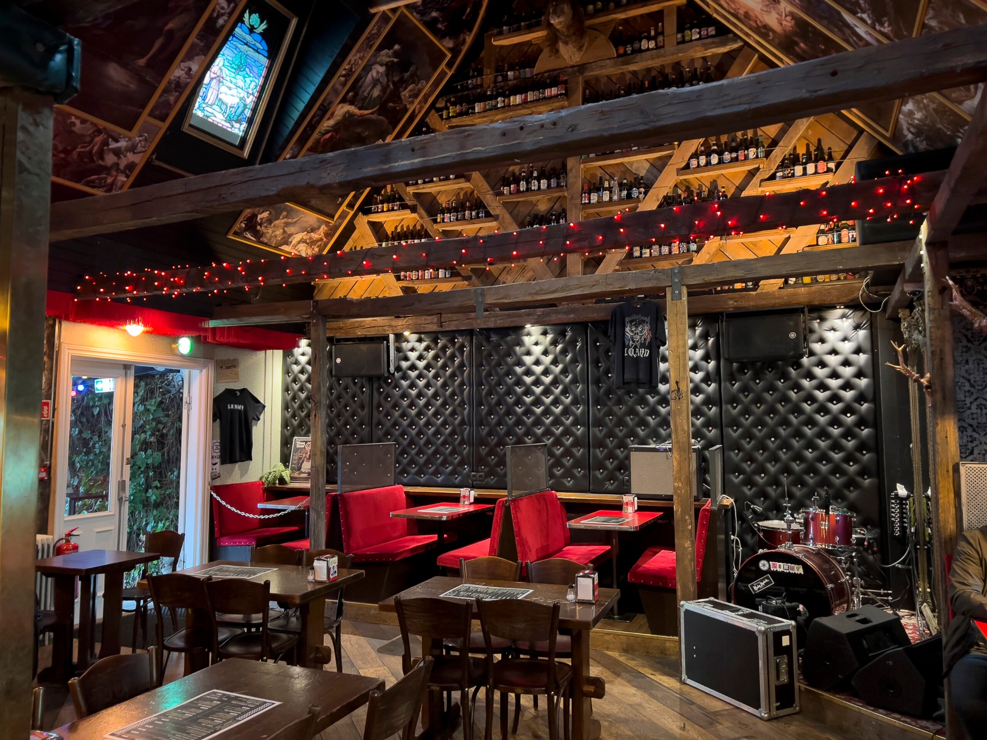 Lemmy's red booths and bottle wall